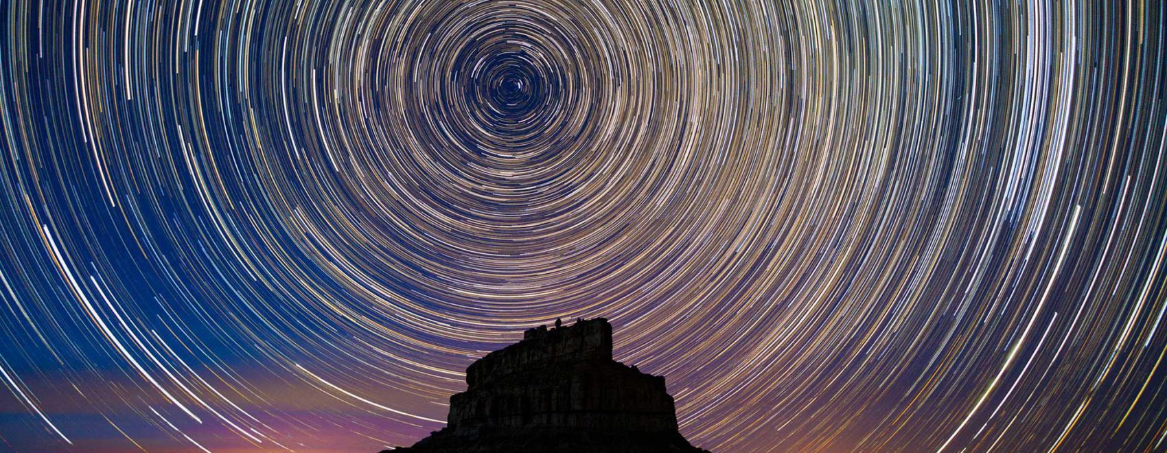 Time-lapse image of stars circling over Fajada Butte | NPS Photo by B. Davis
